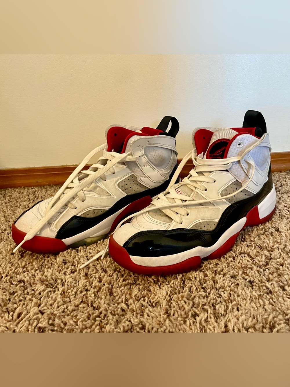 Jordan’s Men's High-Top Athletic Sneakers in White, Black & Red - size 9